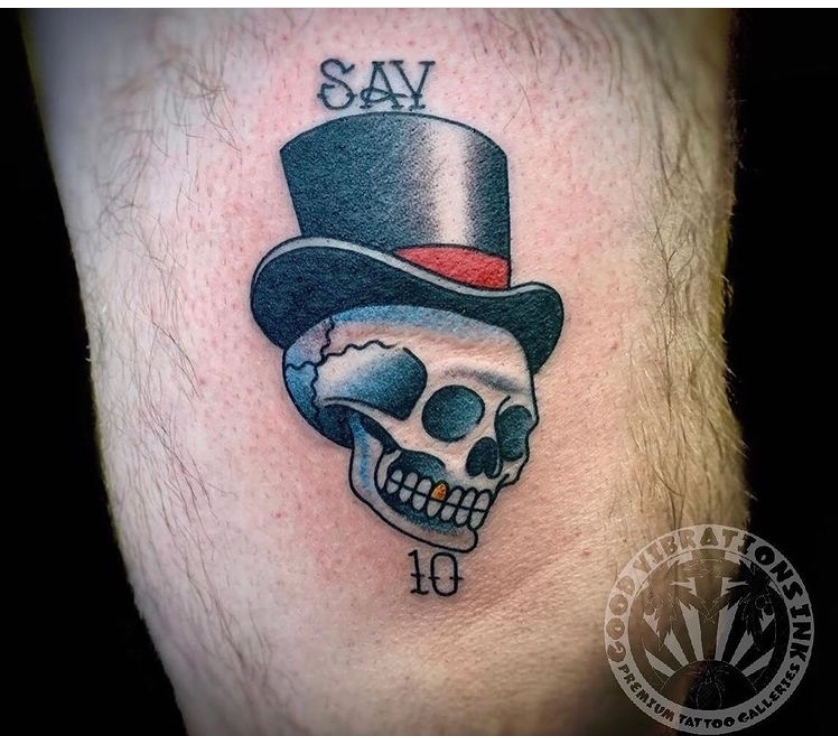 scull in top hat tattoo