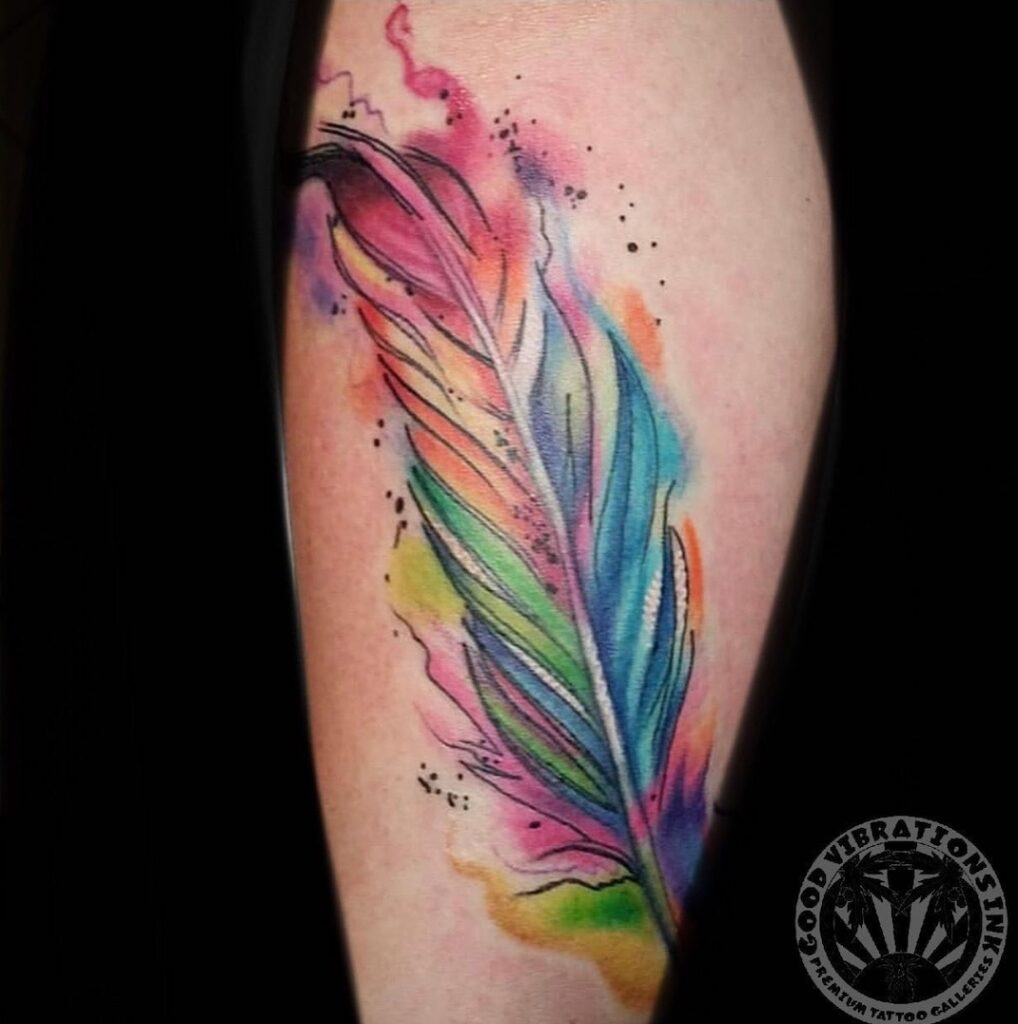 Premium Photo | A watercolor painting of a feather with purple and red  colors.