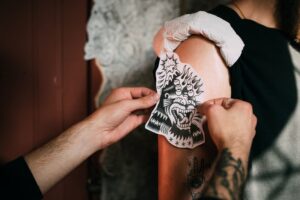 Tattoo fitting and tracing on an arm