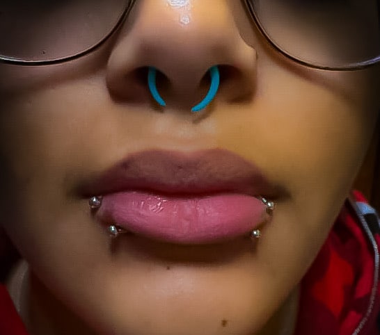 Mack specializes in custom combinations, like the trendy Cyber Bites, which is a pairing of Medusa and labret piercings, which has become a signature look for many clients.